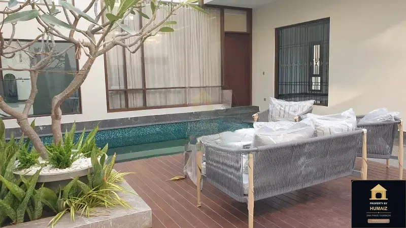 1,000 Sq. Yd. 6-Bedroom Luxury Villa (Basement, 6 Bath, Residence 2) in Zone A For Sale in DHA Phase 8 Karachi — Photograph 5