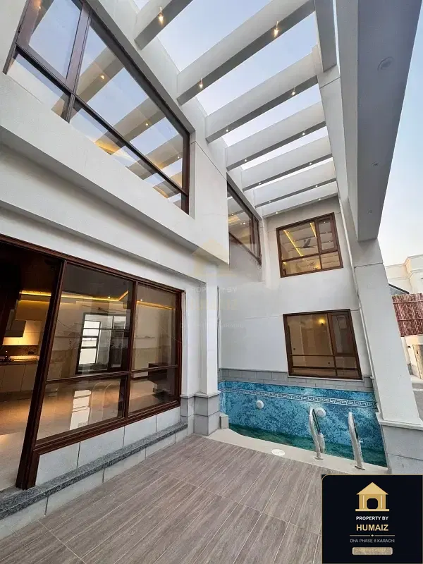 1,000 Sq. Yd. 6-Bedroom Luxury Villa (Private Pool, 6 Bath, Residence 12) in Zone A For Sale in DHA Phase 8 Karachi — Photograph 4