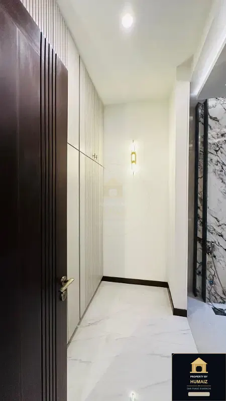 1,000 Sq. Yd. 6-Bedroom Luxury Villa (Basement, 7 Bath, Residence 5) in Zone A For Sale in DHA Phase 8 Karachi — Photograph 13