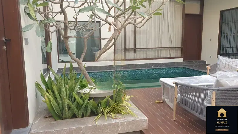 1,000 Sq. Yd. 6-Bedroom Luxury Villa (Basement, 6 Bath, Residence 2) in Zone A For Sale in DHA Phase 8 Karachi — Photograph 2