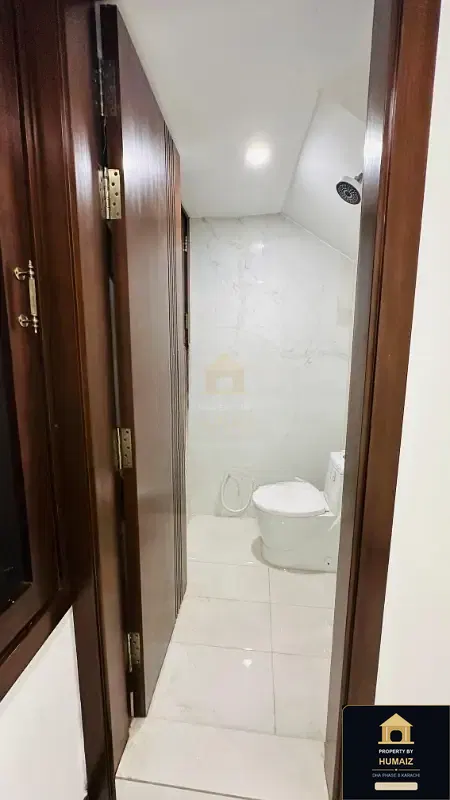 1,000 Sq. Yd. 6-Bedroom Luxury Villa (Basement, 7 Bath, Residence 5) in Zone A For Sale in DHA Phase 8 Karachi — Photograph 22