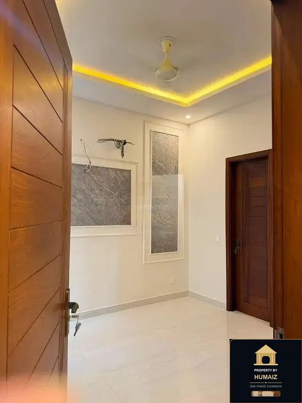 100 Sq. Yd. 4-Bedroom Luxury Villa (Basement, 4 Bath, Residence 3) in Zone B For Sale in DHA Phase 8 Karachi — Photograph 4